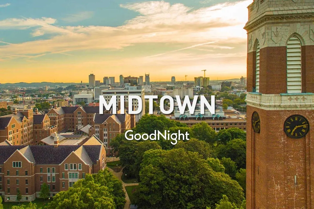 A tranquil cityscape view showcasing the skyline, historic buildings, a clock tower, and leafy trees. The scene captures the peaceful, walkable feel of Midtown and its blend of urban excitement and green retreats.