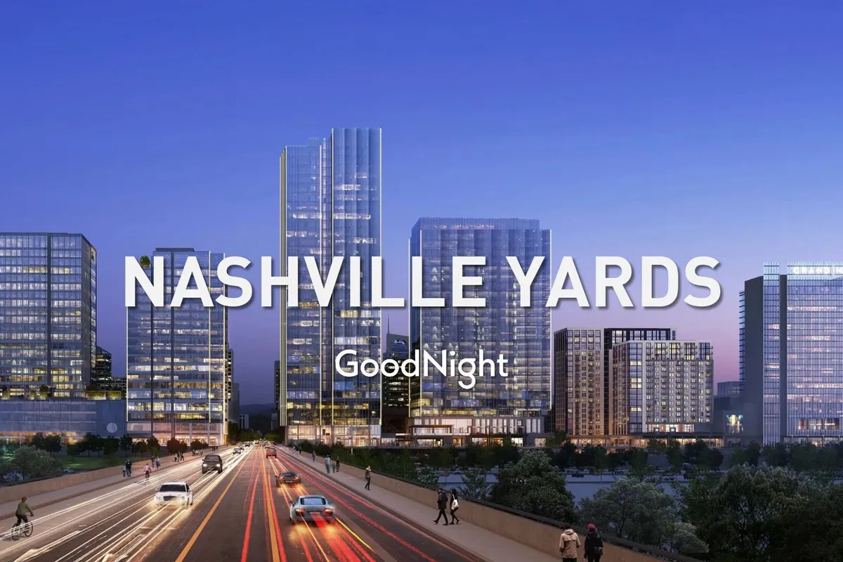 A dynamic cityscape of Nashville at dusk, featuring tall modern skyscrapers and bustling, illuminated streets. The image captures the energetic atmosphere of downtown, hinting at the vibrant city life accessible from Willow.